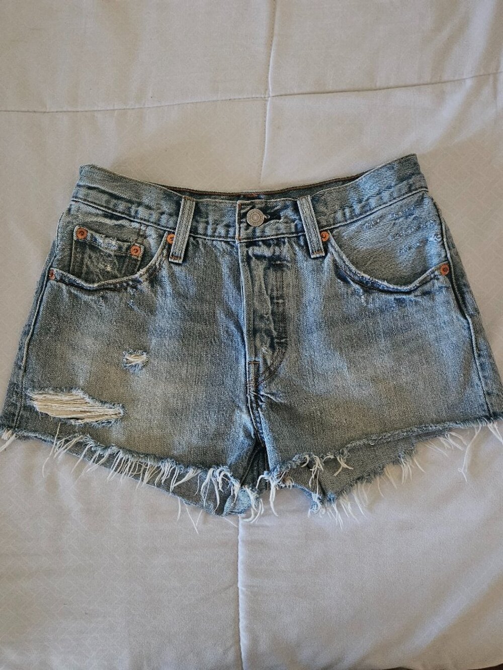 Levi's 501 distressed blue denim cut of shorts with button fly size 26